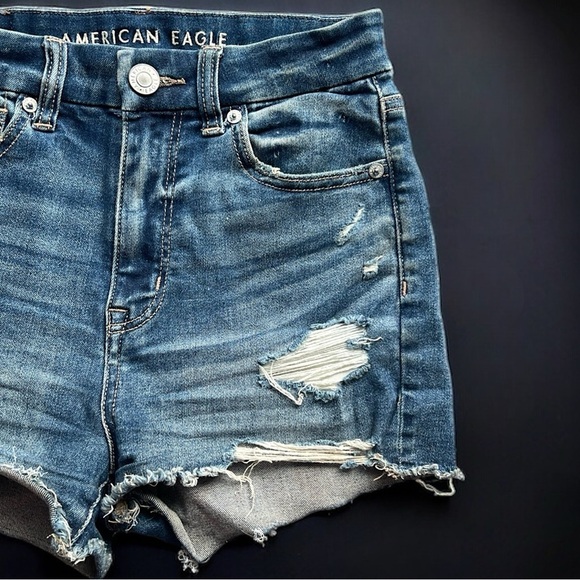 AE Next Level Stretch Curvy High Rise Shortie Distressed Denim Shorts - Picture 3 of 10